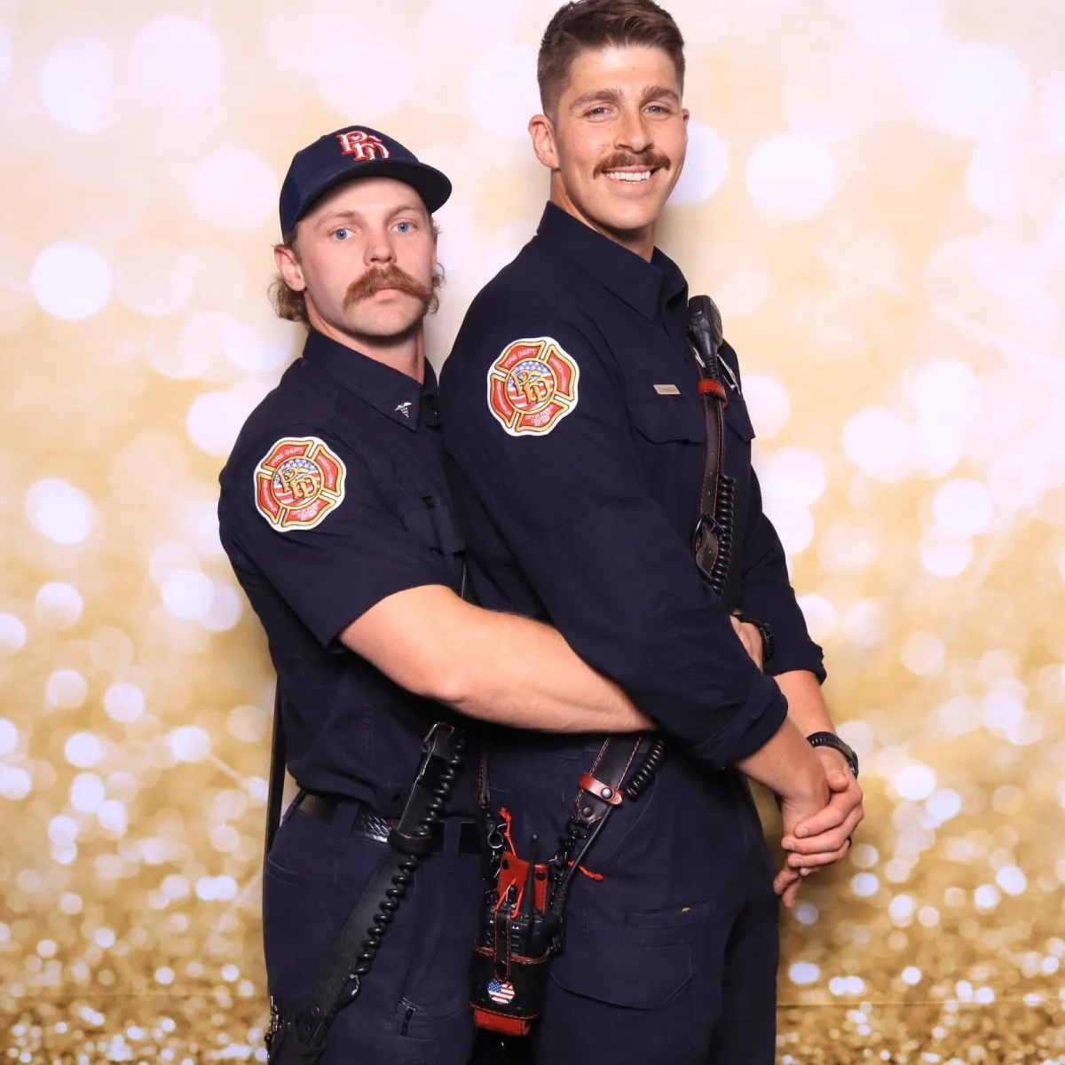 Pueblo firefighters striking a fun pose in Martini Moment Photo Booth at Bingo, Bags & Heroes fundraiser Pueblo Convention Center