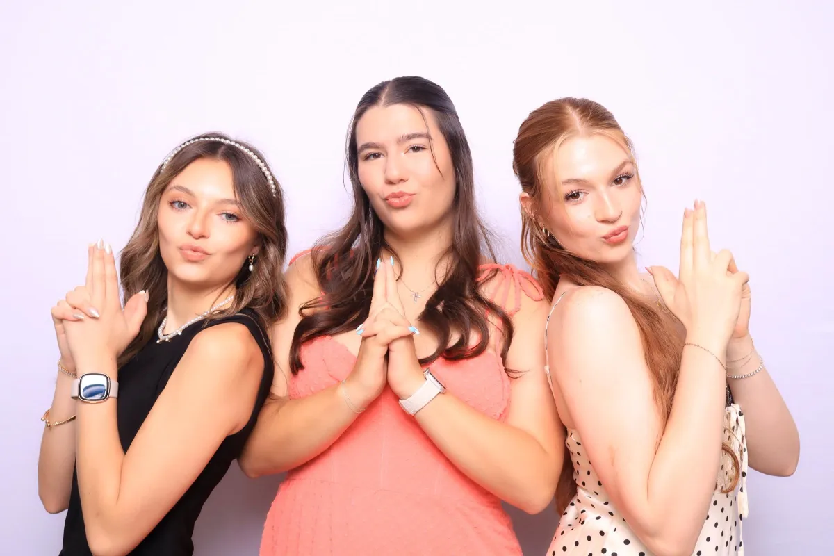 colorado wedding guests posing fun in a photo booth at elegant wedding