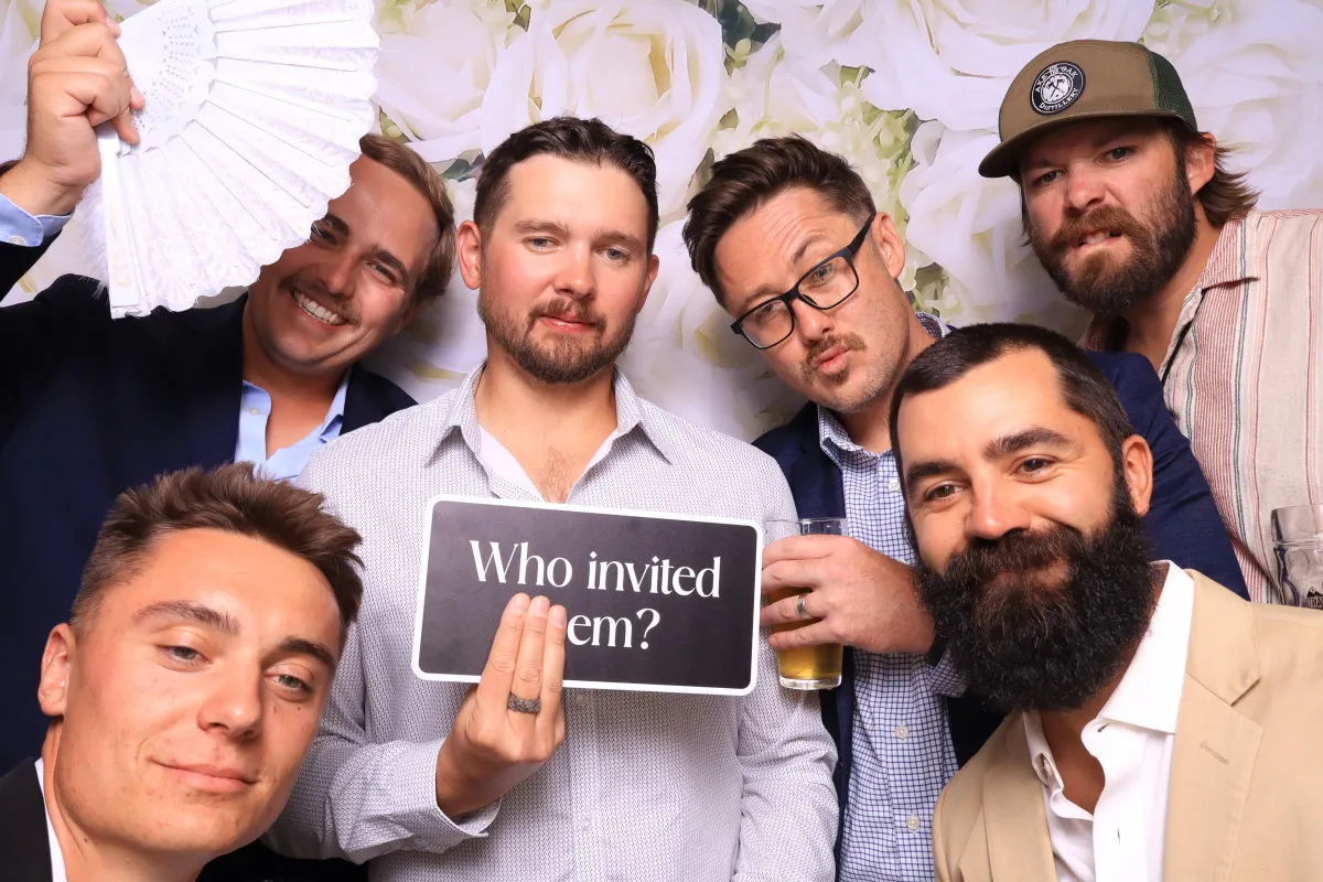groomsmen posing in photo booth at the pinery in colorado prings