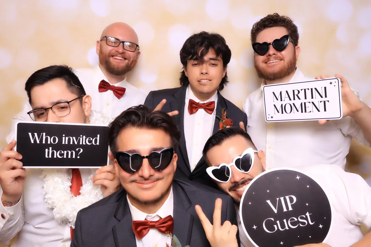 bridesmaids taking photo booth pictures in an upscale wedding in Pueblo