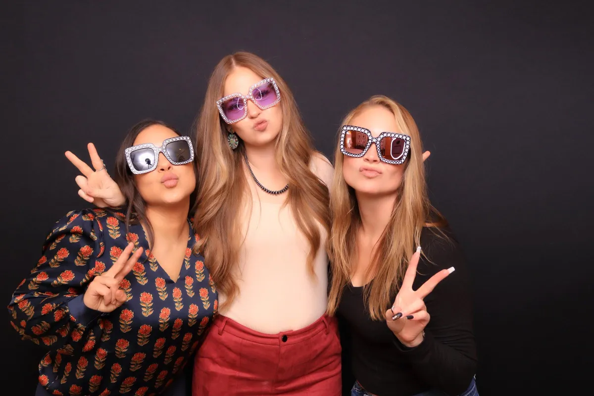 bridesmaids taking photo booth pictures in an upscale wedding in Pueblo