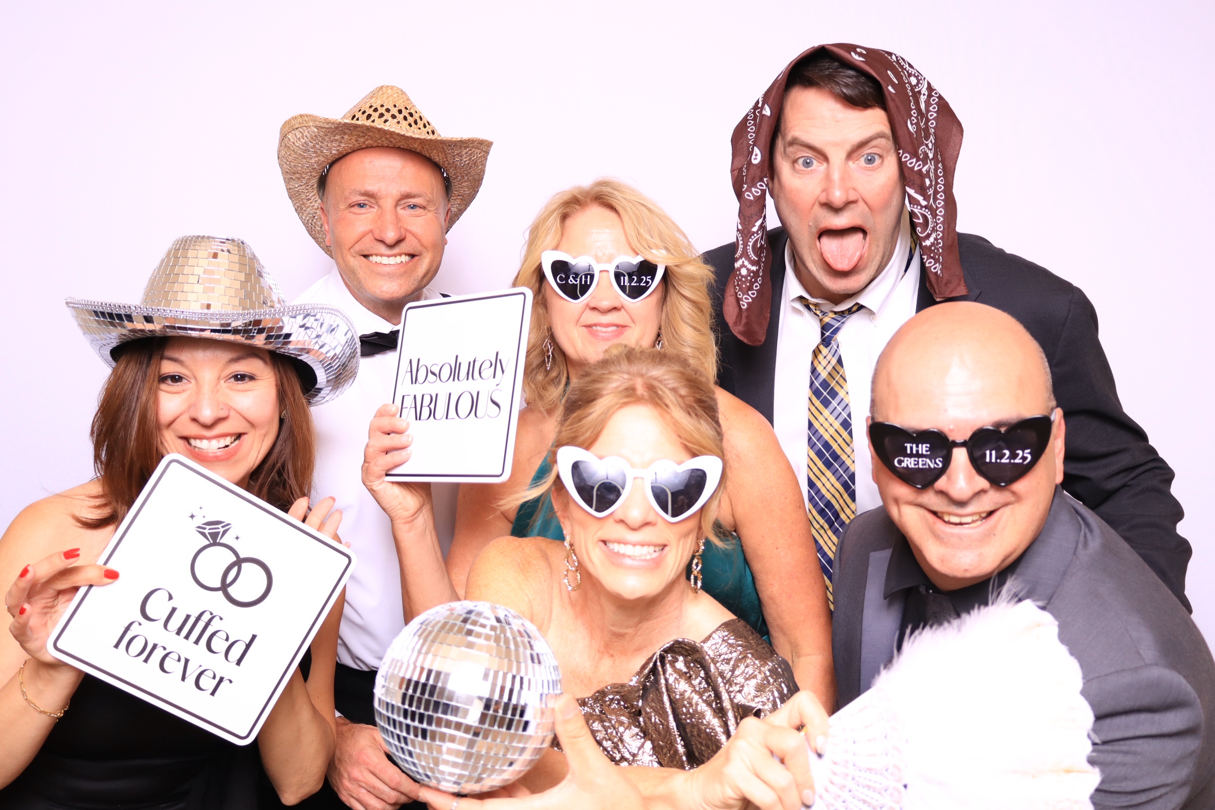 groomsmen posing in photo booth at the pinery in colorado prings