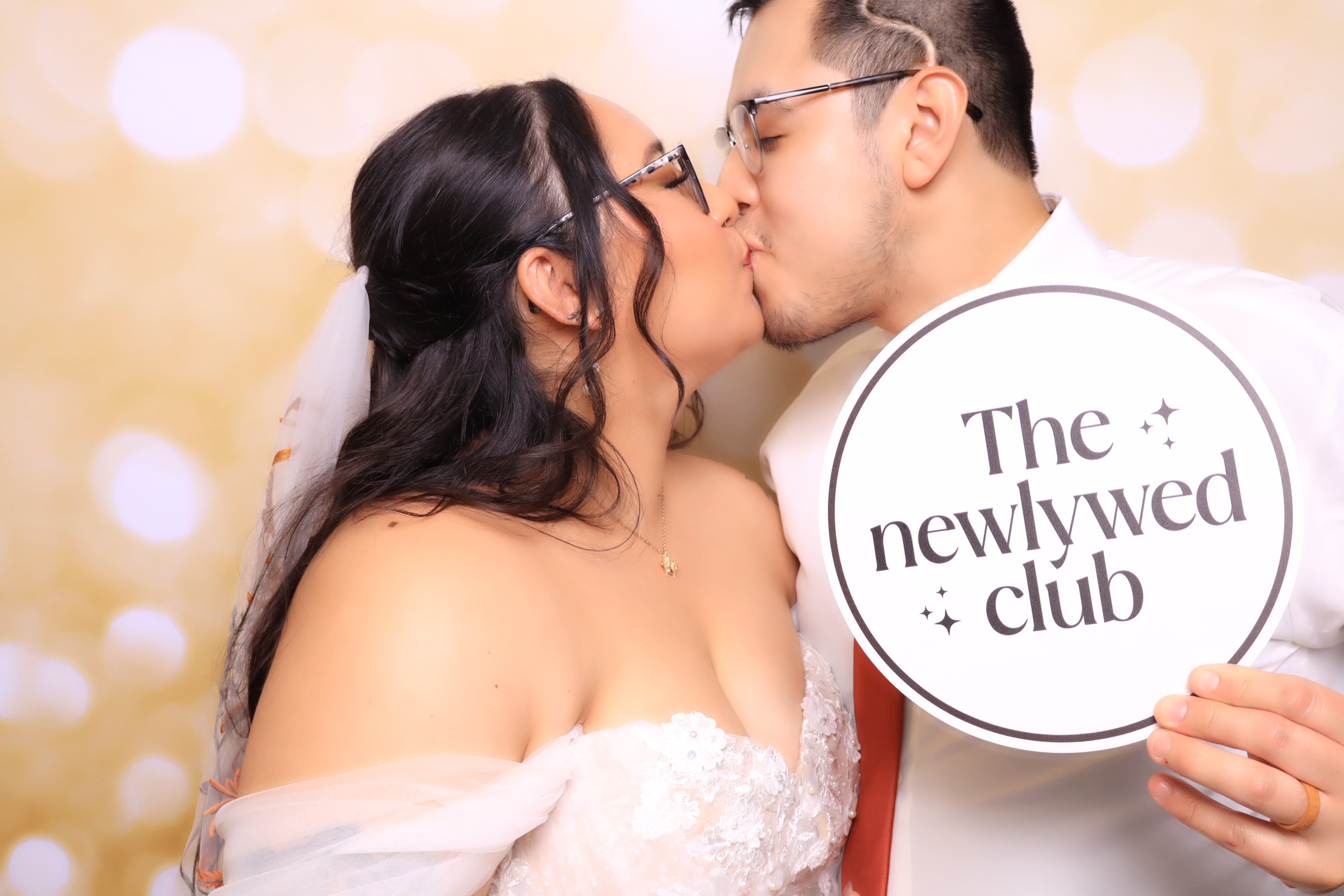 Married Couple taking glam photo booth pictures in a luxury wedding in Color