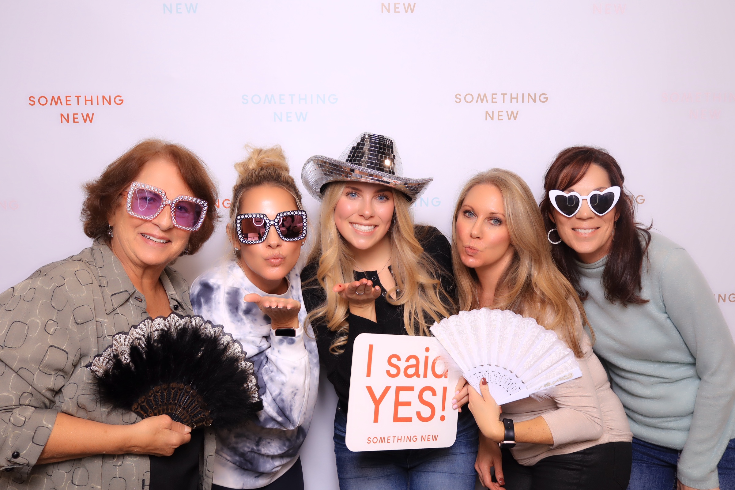 Something New Boutique posing in a luxury photo booth rental in Colorado Springs 