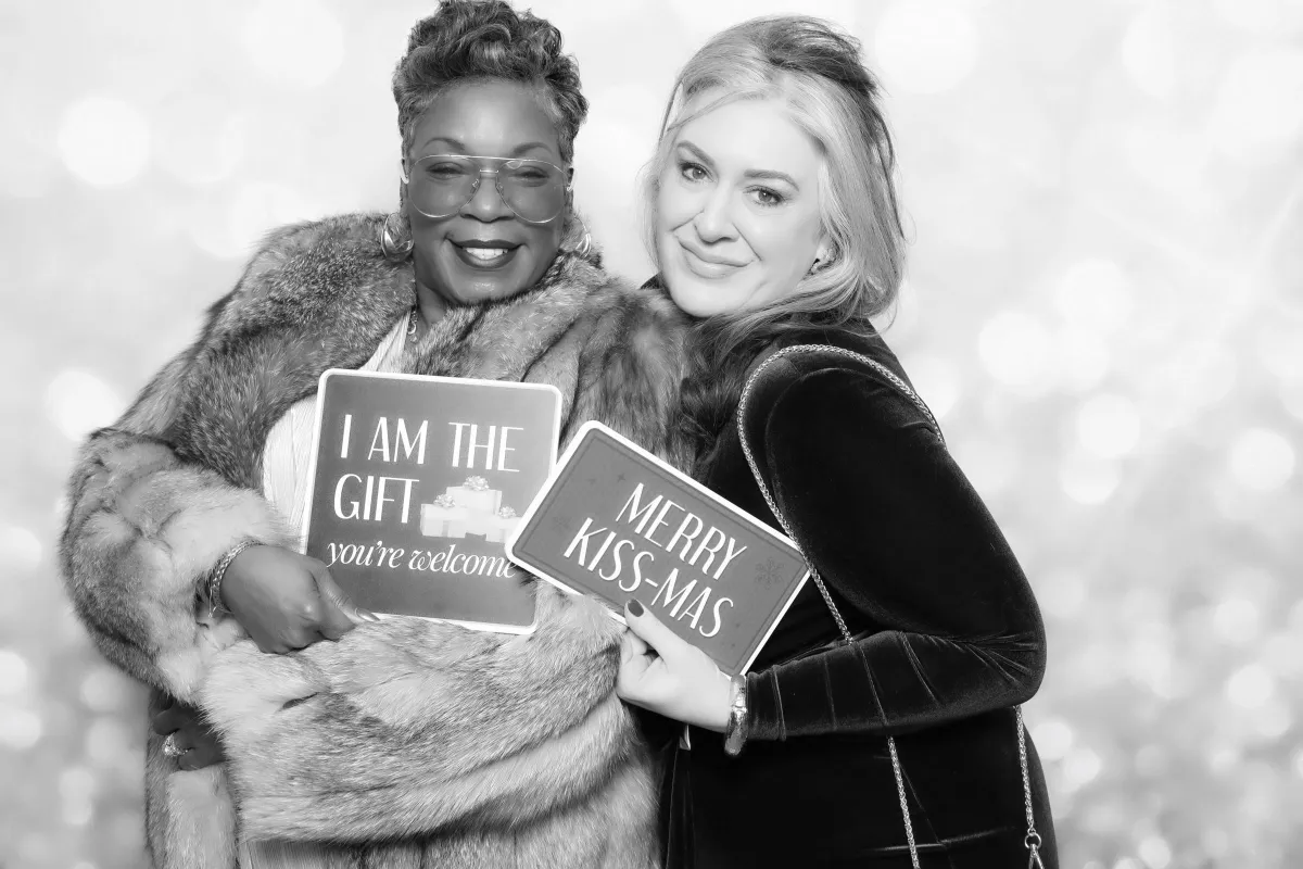 bridesmaids taking photo booth pictures in an upscale wedding in Pueblo