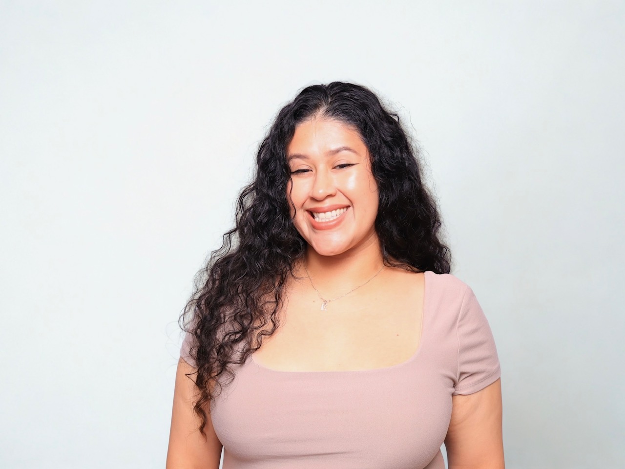 Karla, founder of Martini Moment Photo Booths, smiling while sharing her passion for capturing unforgettable wedding and event memories