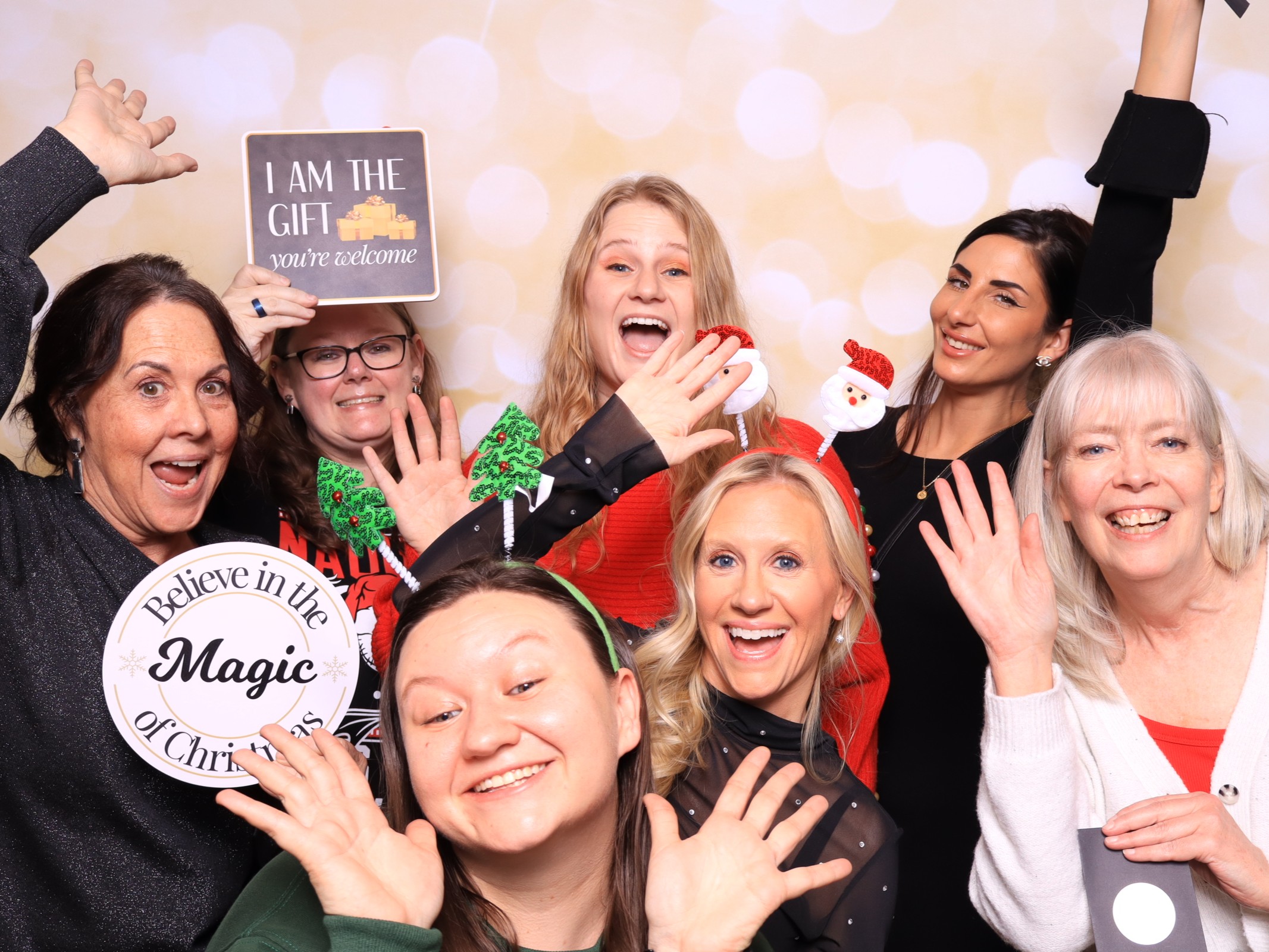Corporate team enjoying a luxury glam photo booth at a holiday party in Colorado Springs