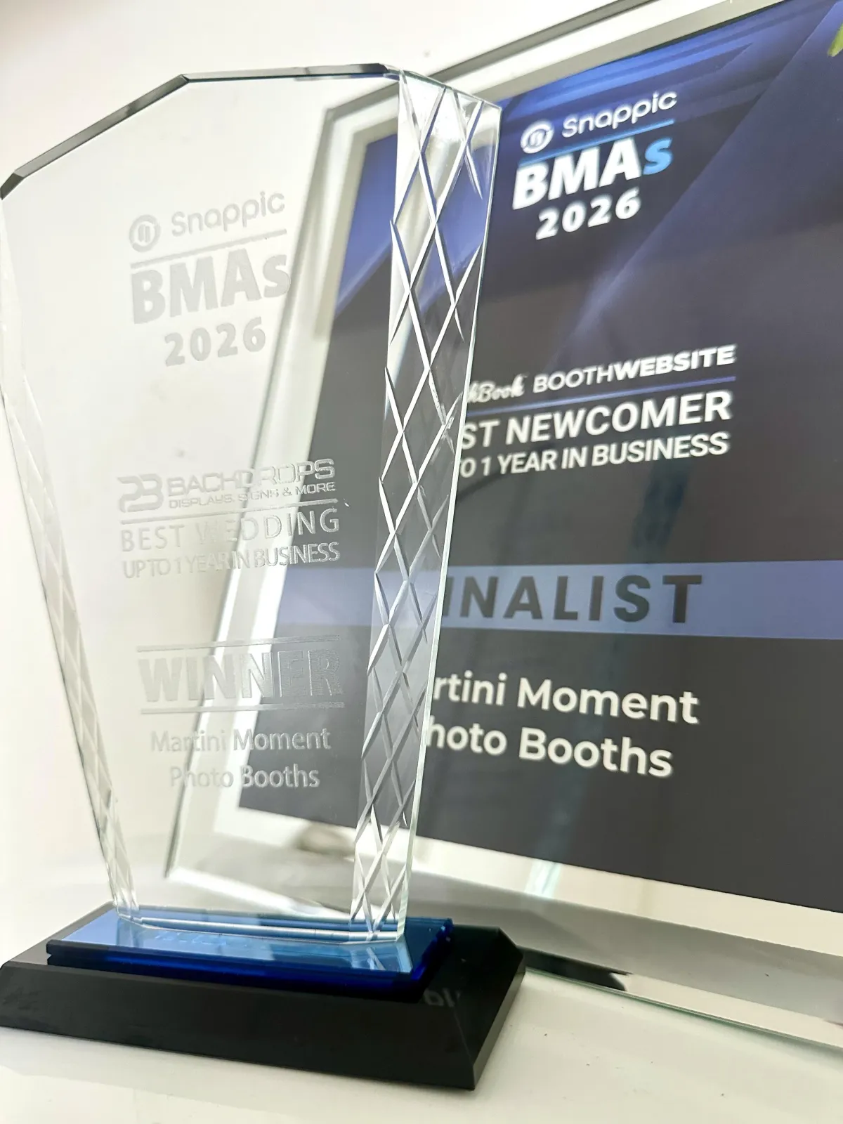 wedding guest at luxury wedding posing in luxury photo booth in colorado springs