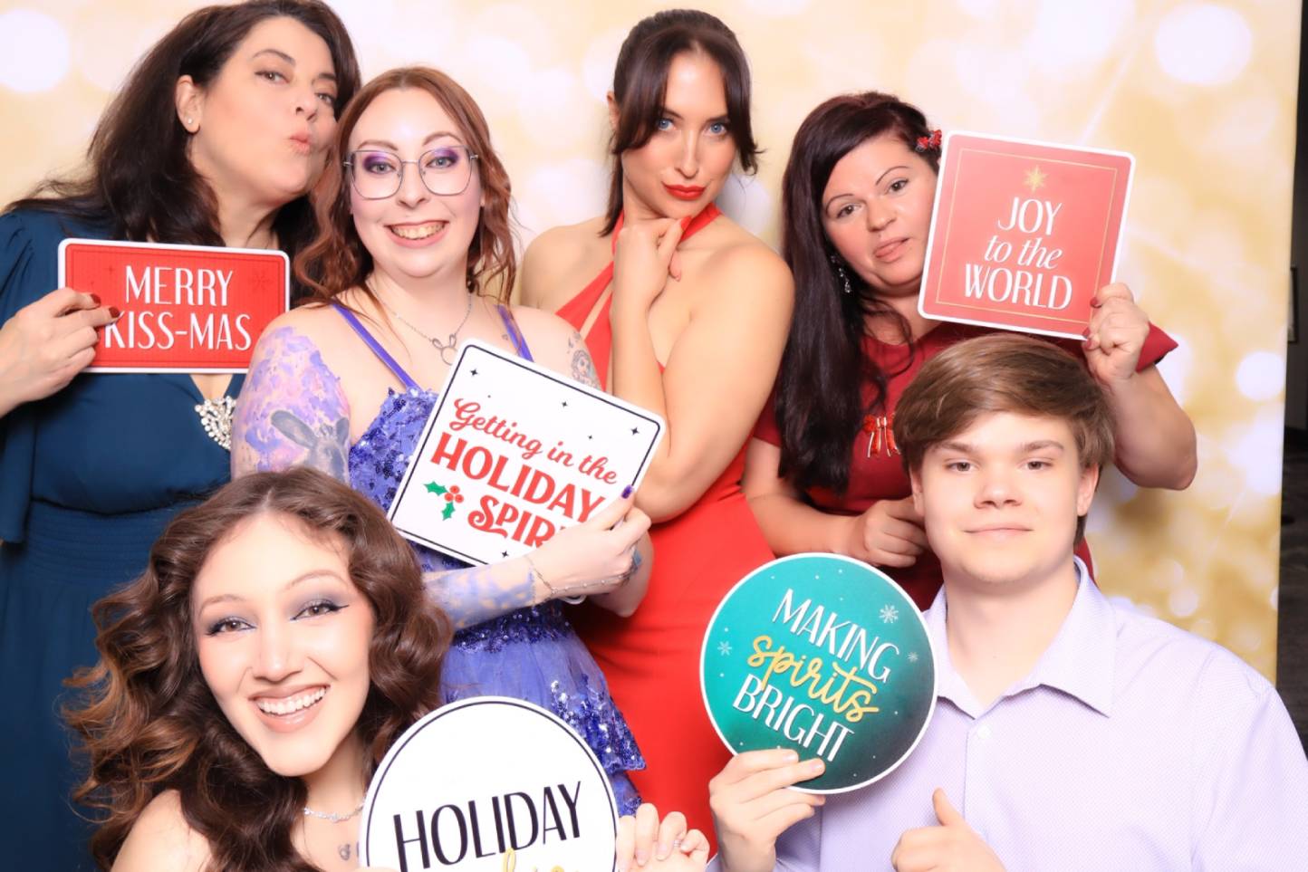Corporate team enjoying a luxury glam photo booth at a holiday party in cheyenne mountain resort inColorado Springs