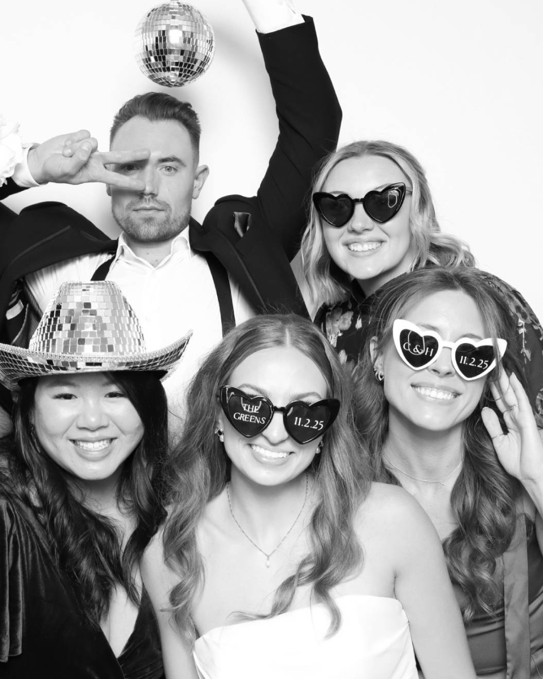 wedding guests taking glam photo booth pictures in a luxury wedding in Colorado Springs