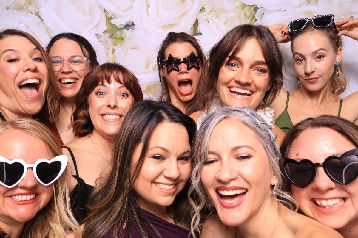 bridesmaids taking photo booth pictures in an upscale wedding in Pueblo