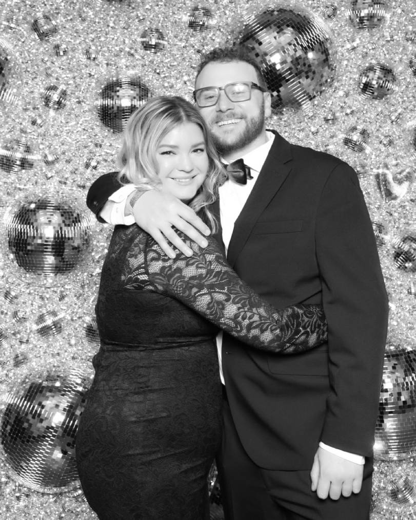 Corporate team enjoying a luxury glam photo booth at a holiday party in Colorado Springs