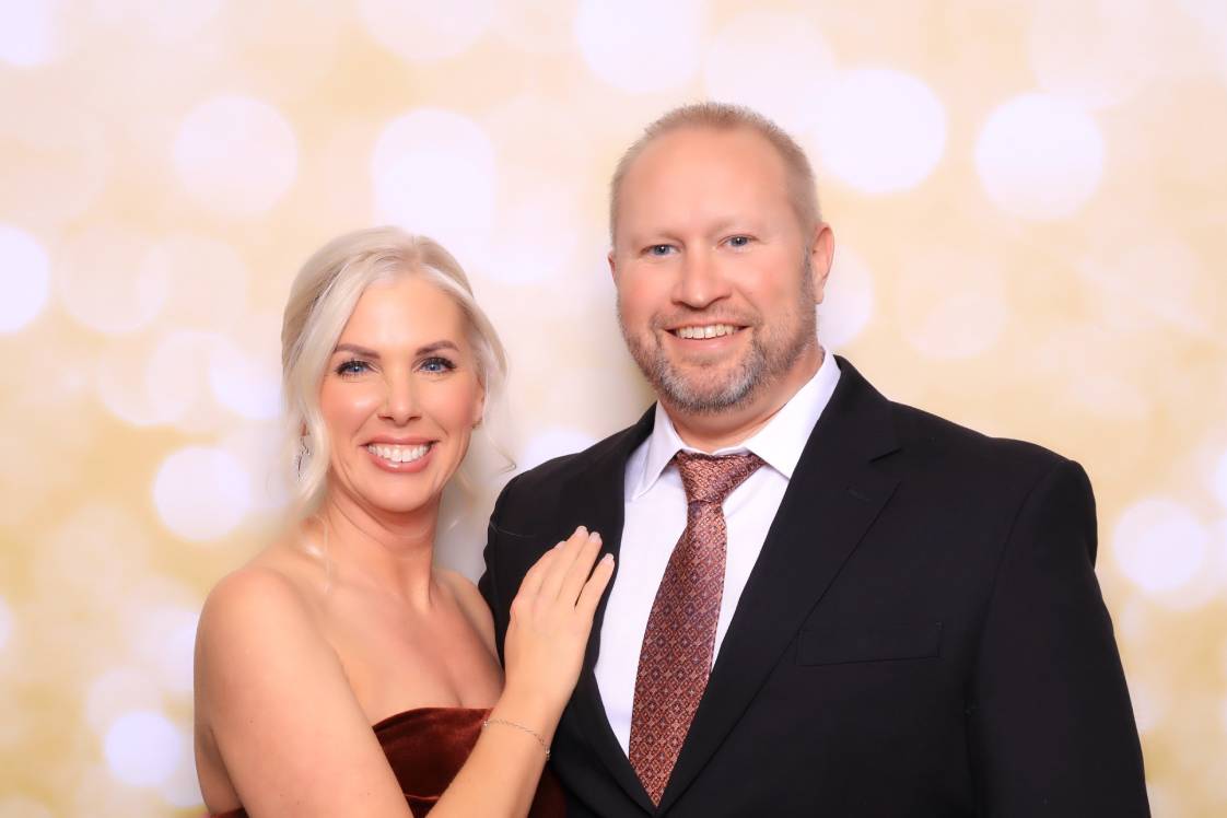 Corporate team enjoying a luxury glam photo booth at a holiday party in Colorado Springs