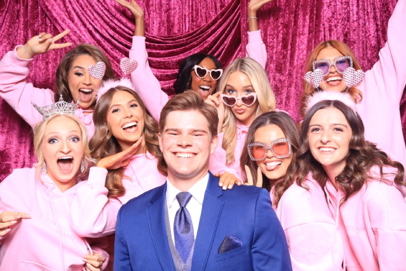 Something New Boutique stylists posing in Martini Moment Photo Booths in colorado springs