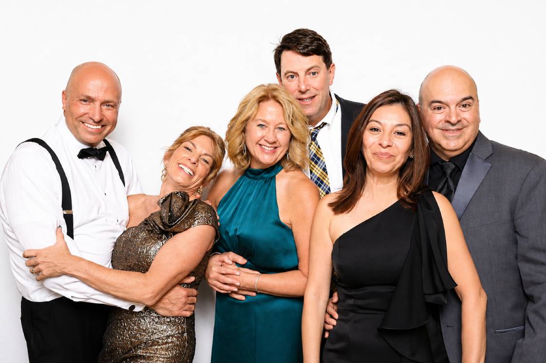 Friends taking a keepsake photo during a wedding reception photo booth moment in colorado springs