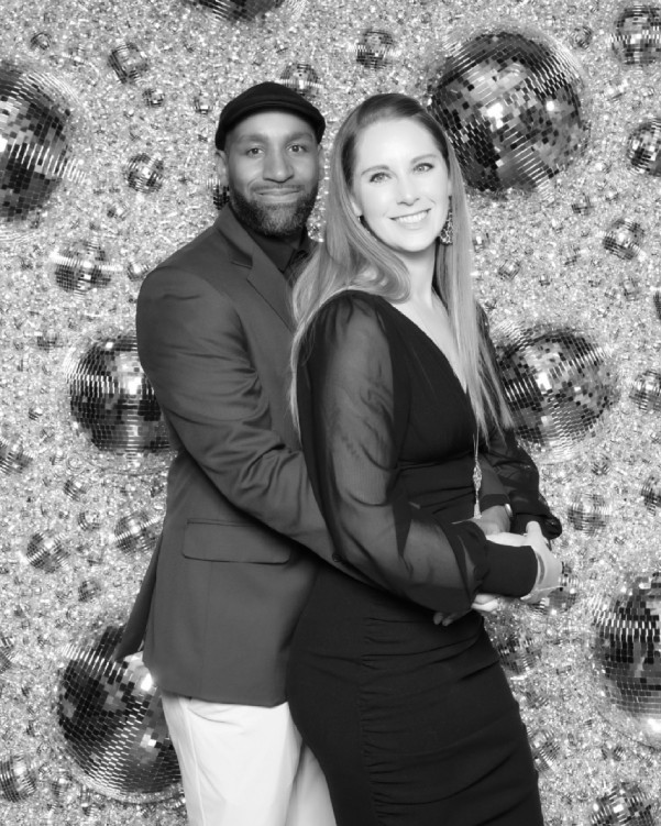 Corporate team enjoying a luxury glam photo booth at a holiday party in Colorado Springs