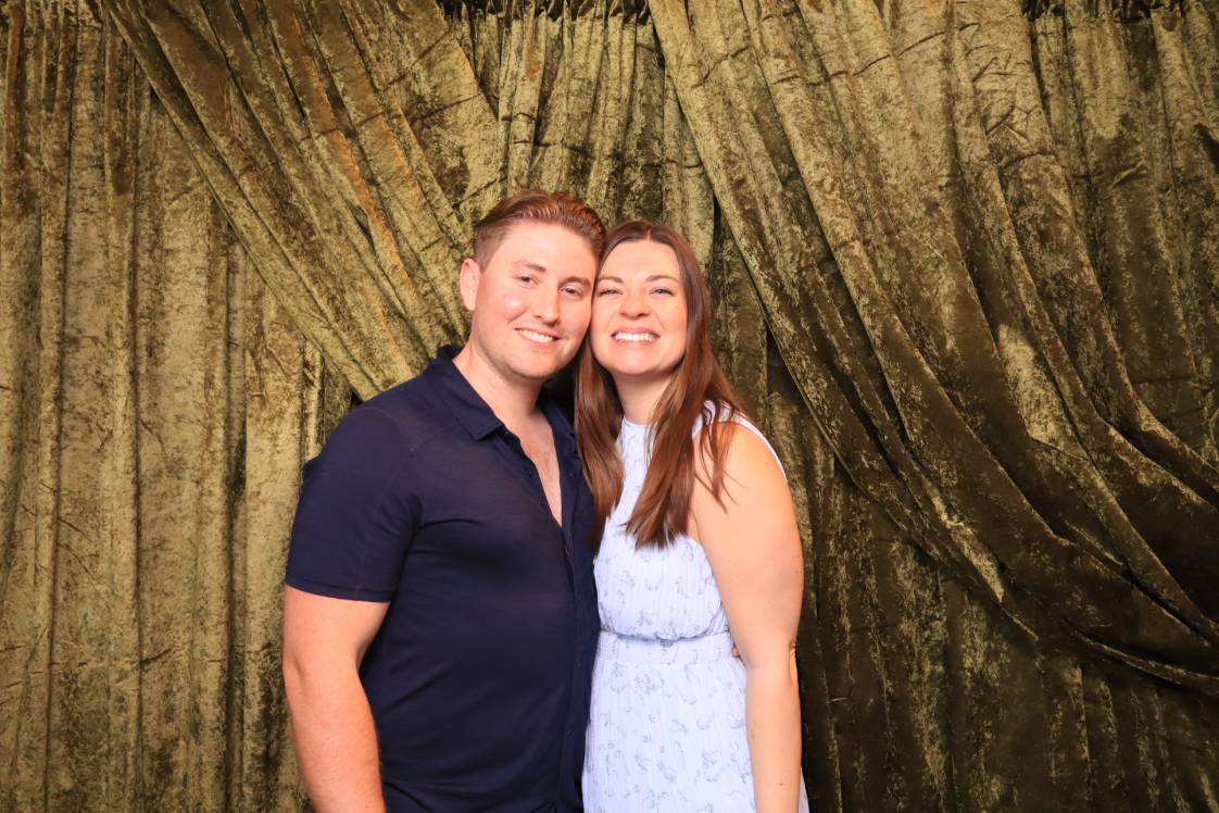 Couples posing for a photo booth at a Colorado Springs wedding reception