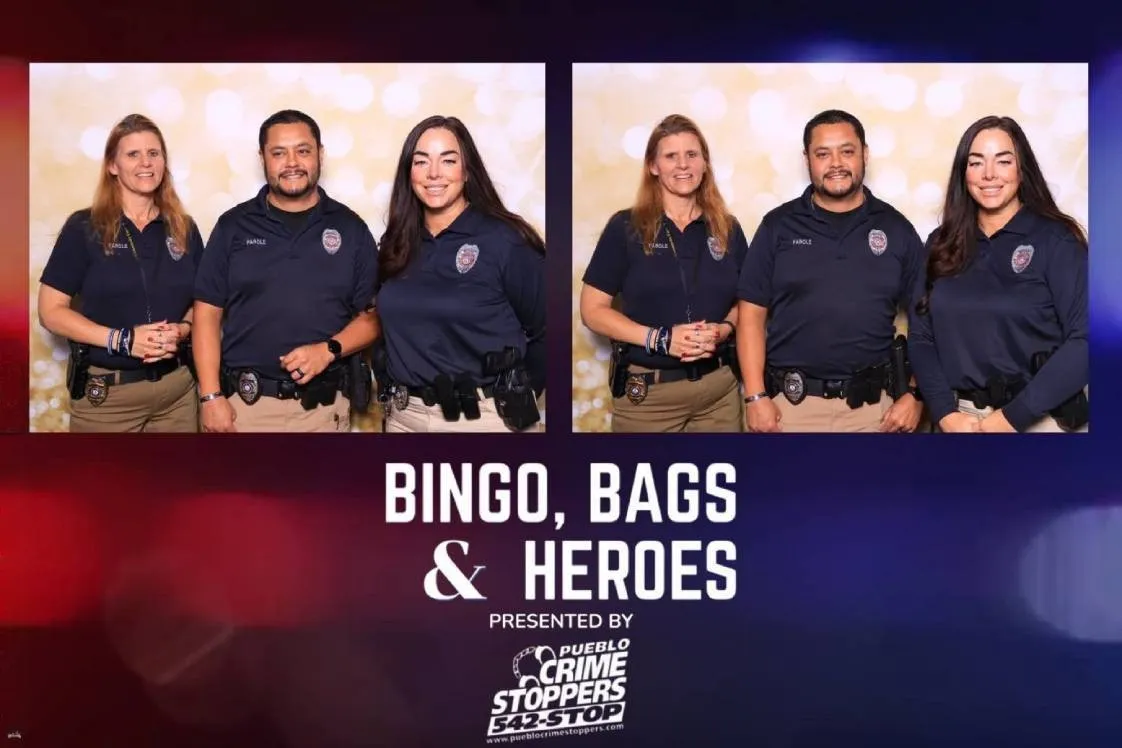 Guest celebrating with prize basket at Bingo, Bags & Heroes fundraiser for Pueblo Crime Stoppers, captured by Martini Moment Photo Booth in Pueblo Colorado