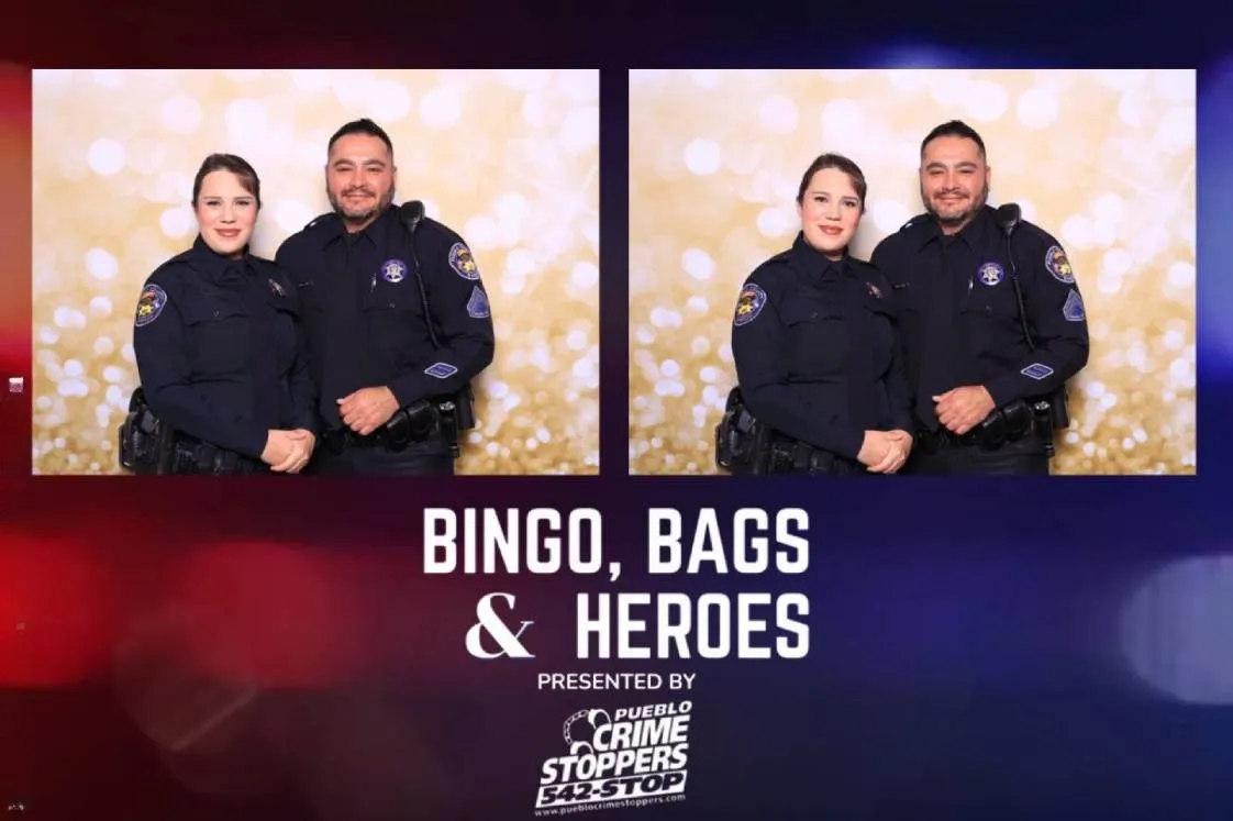Two Pueblo police officers posing in Martini Moment Photo Booth at community event at the Pueblo Convention Center