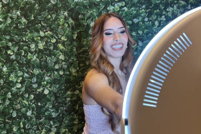 friends having fun in a photo booth in colorado springs