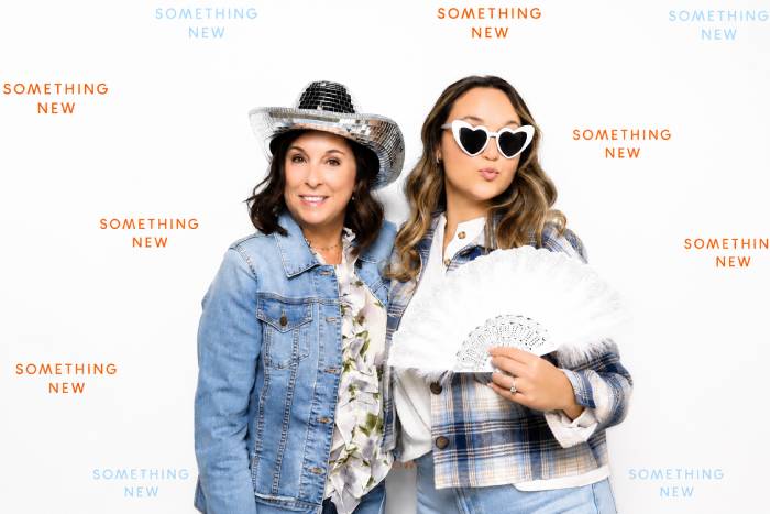 Bride and mom at something new using luxury photo booth in colorado springs