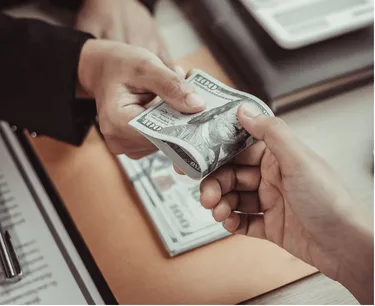 Worker holding money