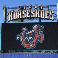 hands formed together with red heart paint