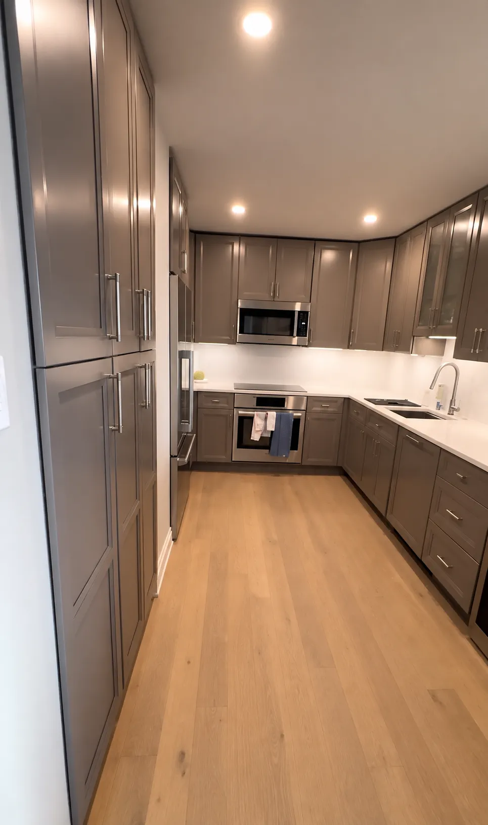 Wide plank European white oak flooring paired with large format porcelain tile