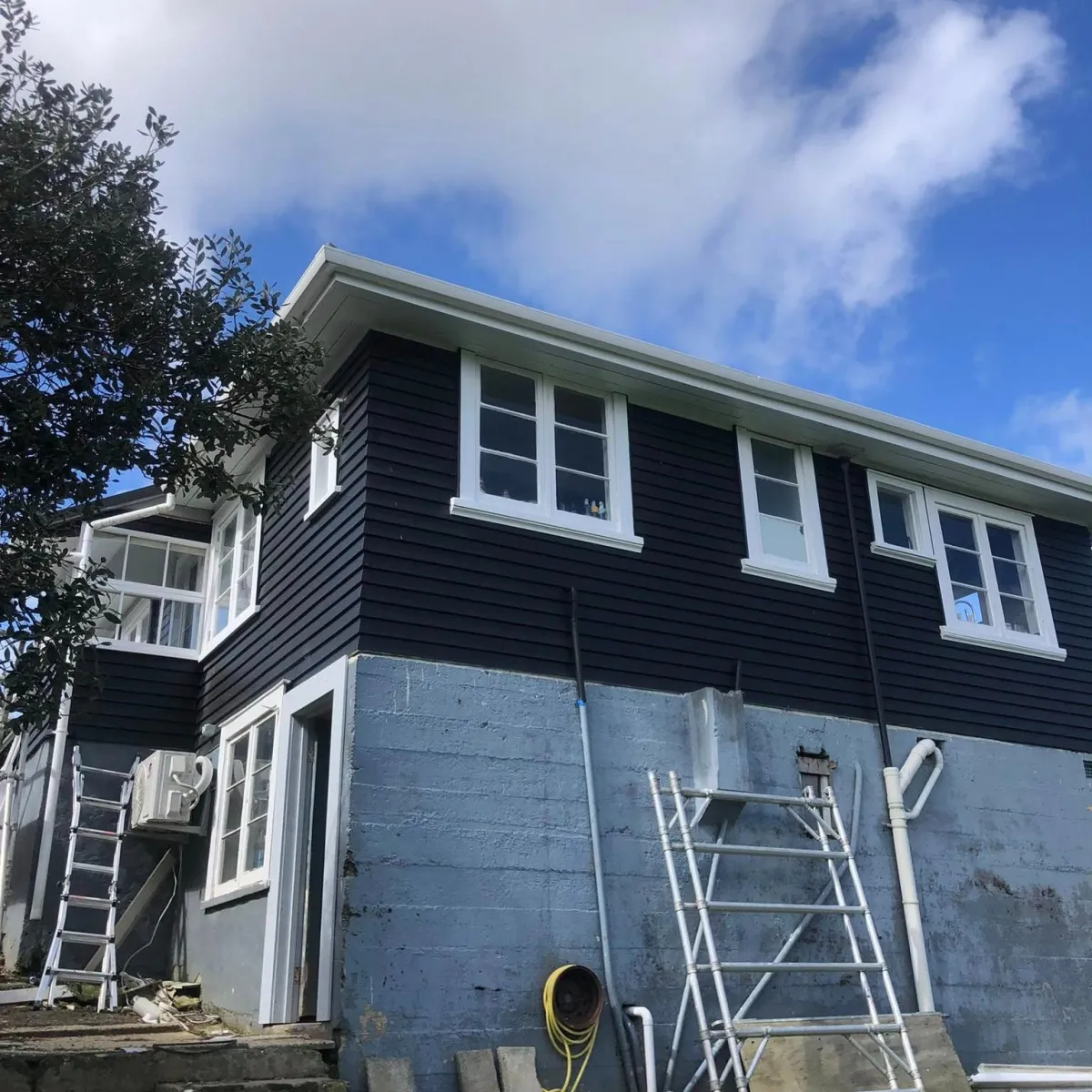 Exterior house painting completed on dark weatherboard home Far North New Zealand