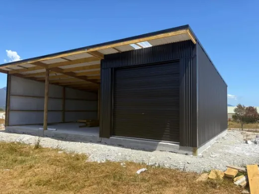 Pole shed with open lean-to constructed by J Millar Builders Ltd in Greymouth West Coast
