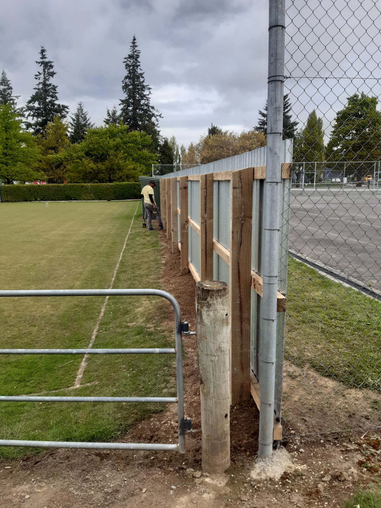 New post and rail boundary fence built beside a sports field in Canterbury