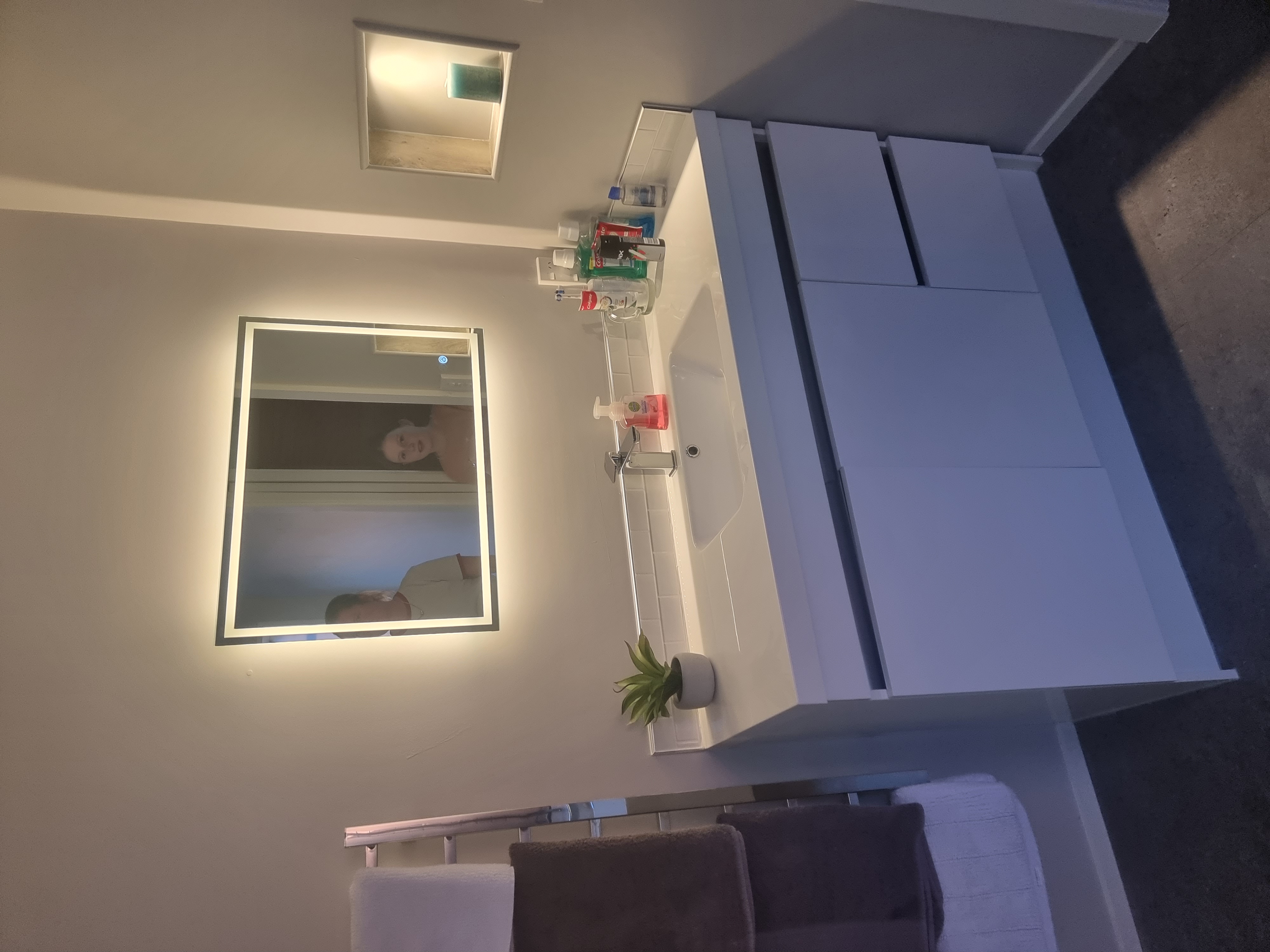 Modern bathroom renovation with new vanity and mirror by Opuke Small Builds in Methven