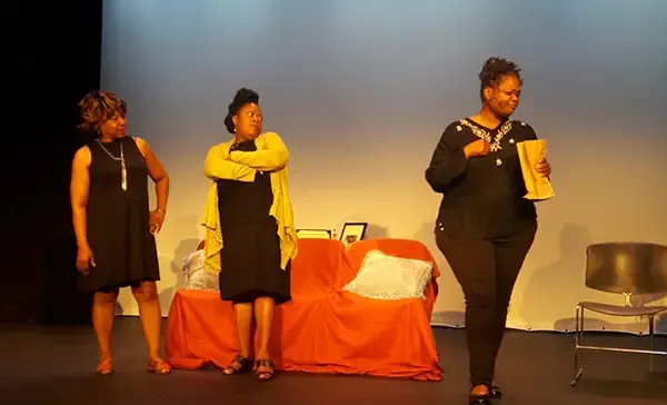 Rev. Lawrence and Karen Scott on stage