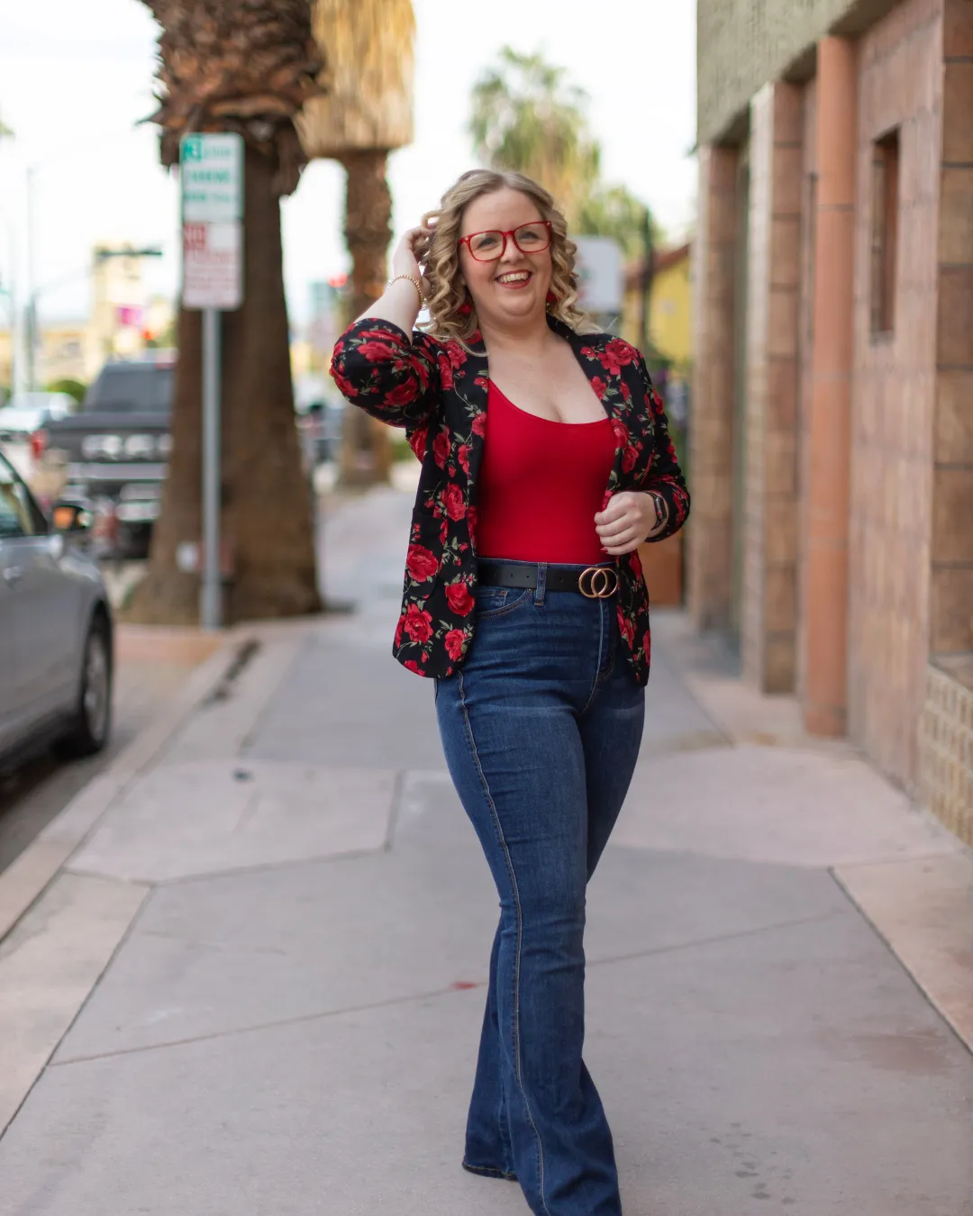 Founder and lead coach in a sunlit studio, exuding calm, authentic warmth