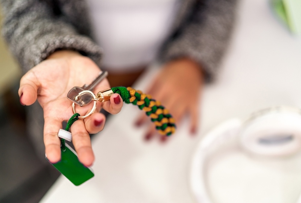 airbnb host holding out hand with keys