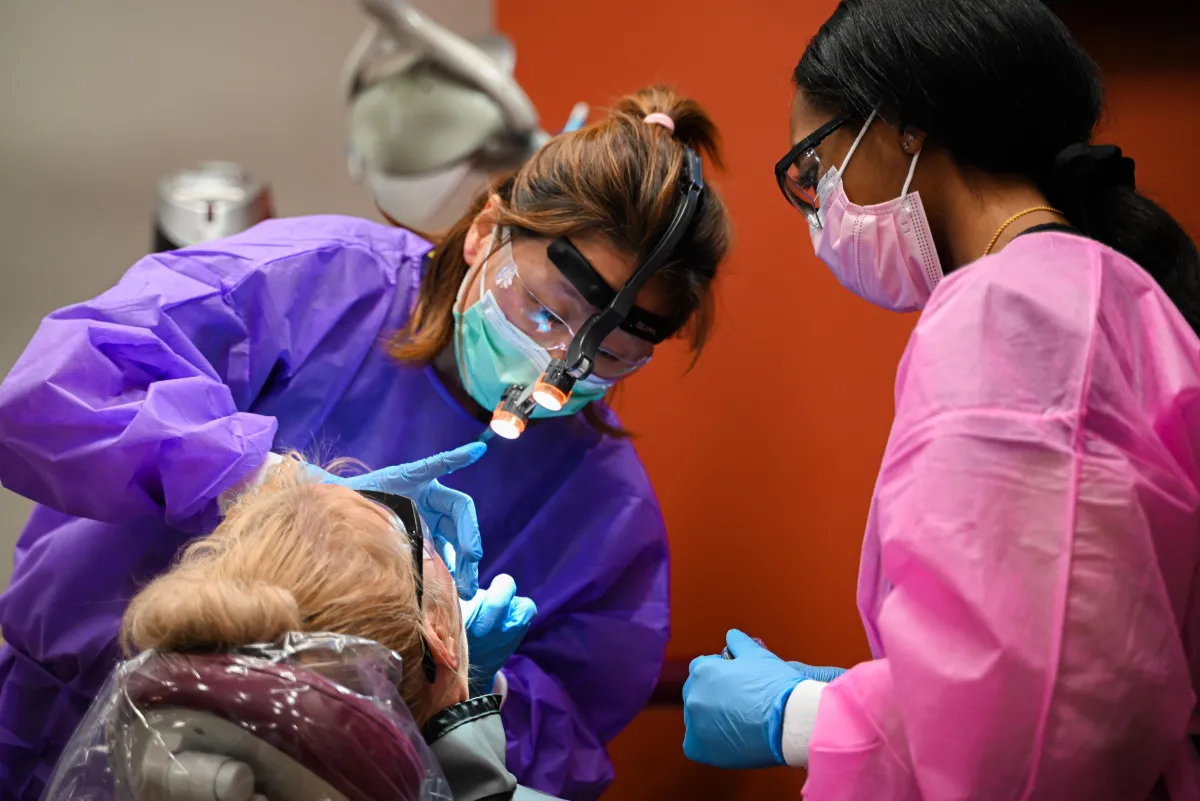 Dental team reviewing patient insurance benefits