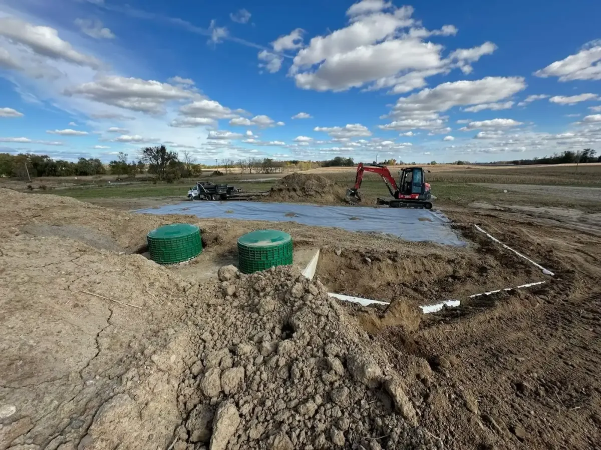 Bulldozer grading and shaping soil for a large residential site preparation