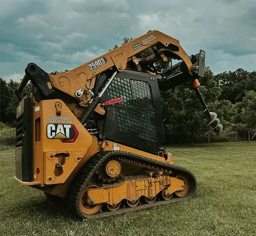 Excavator digging a basement foundation for a new custom home build