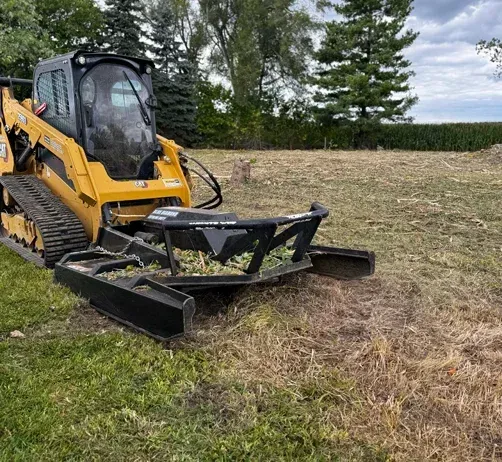 Heavy forestry mulcher clearing a wooded acreage lot for development