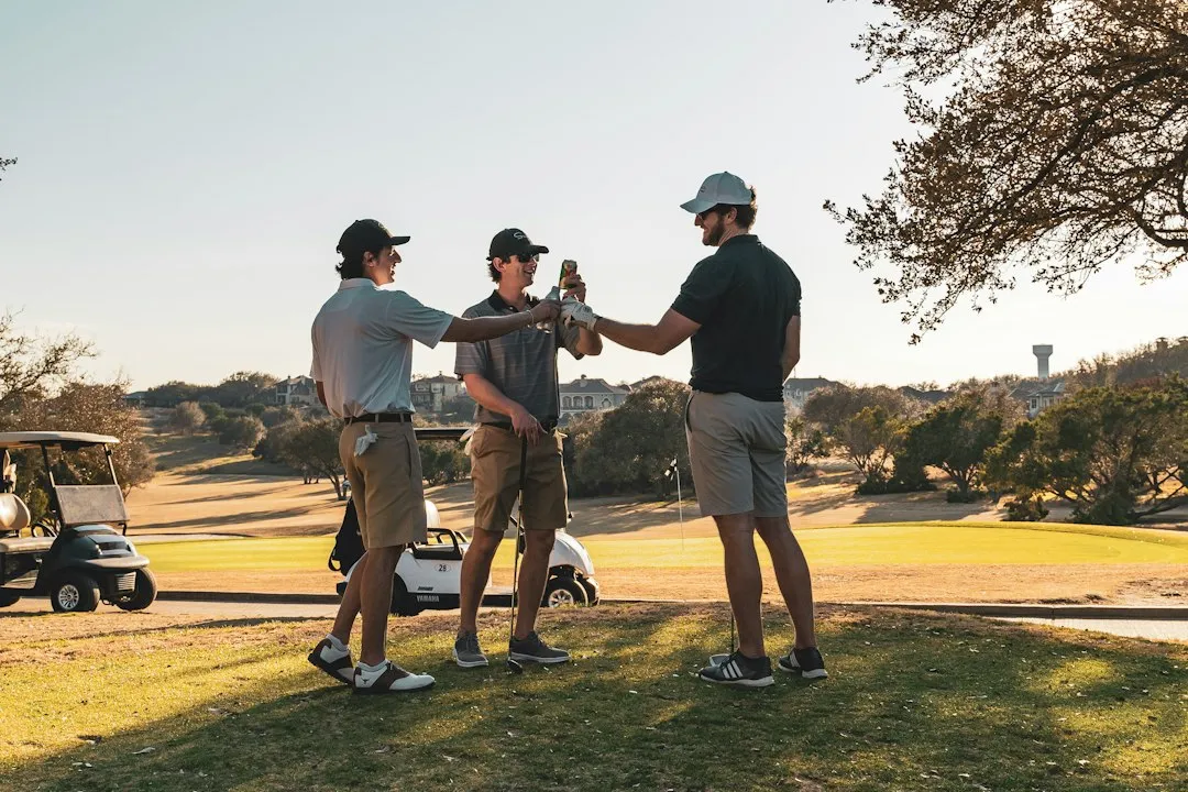 corporate team celebrating a successful putt
