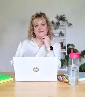 Nichola Wilkin creating teaching resources at desk at home