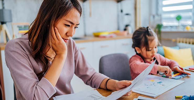 Elderly couple managing finances at home
