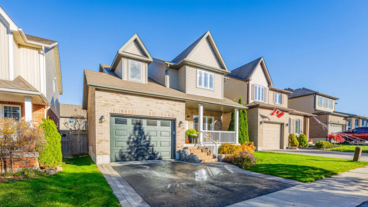 Two-storey brick home with attached one-car garage located in the Edgewood Valley neighbourhood in Orangeville