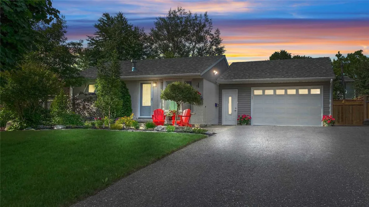 A bungalow with attached garage at sunset located in the Midtown Orangeville neighbourhood