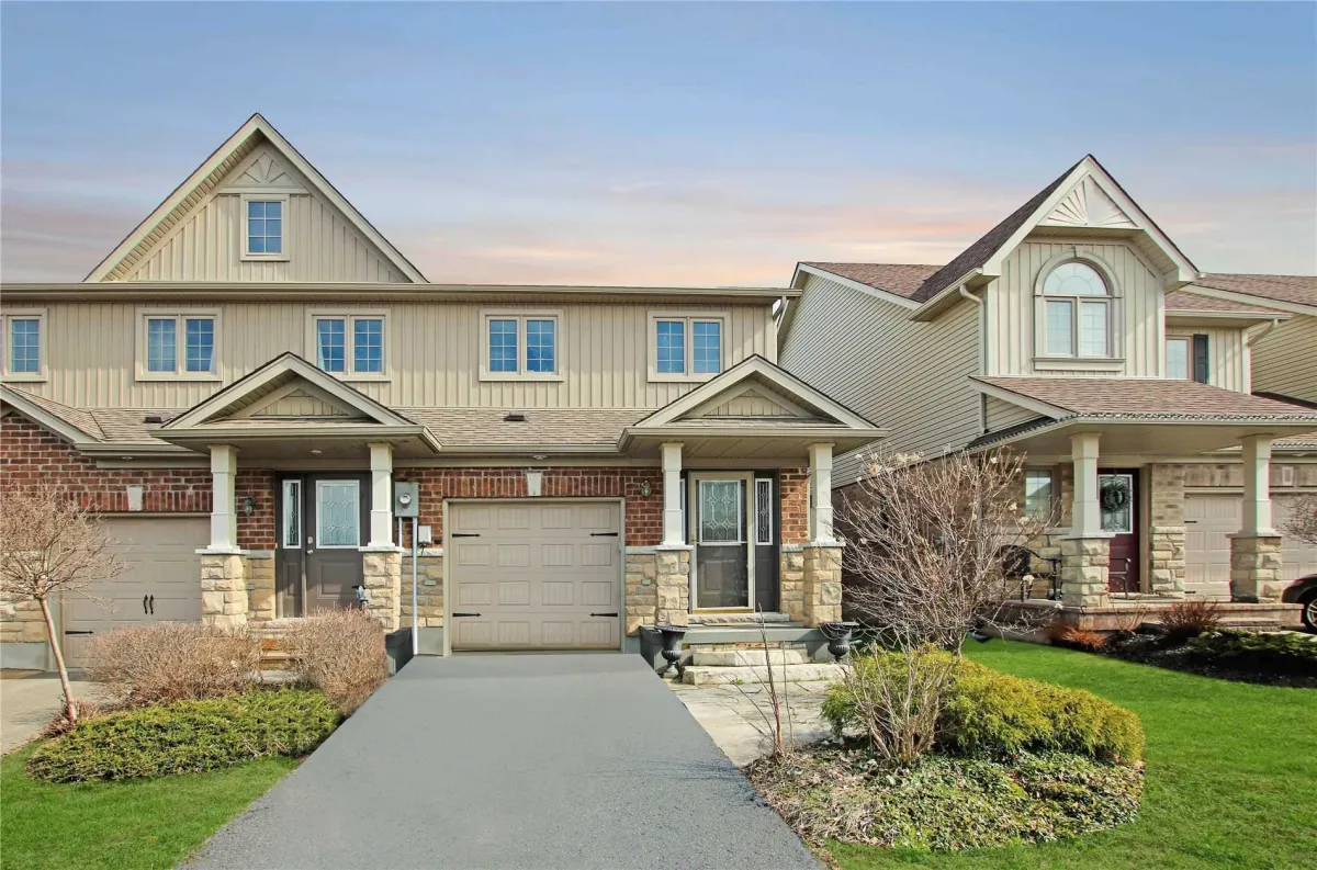 Two storey semi-detached brick and siding home with built-in 1-car garage located in the Orangeville Highlands neighbourhood