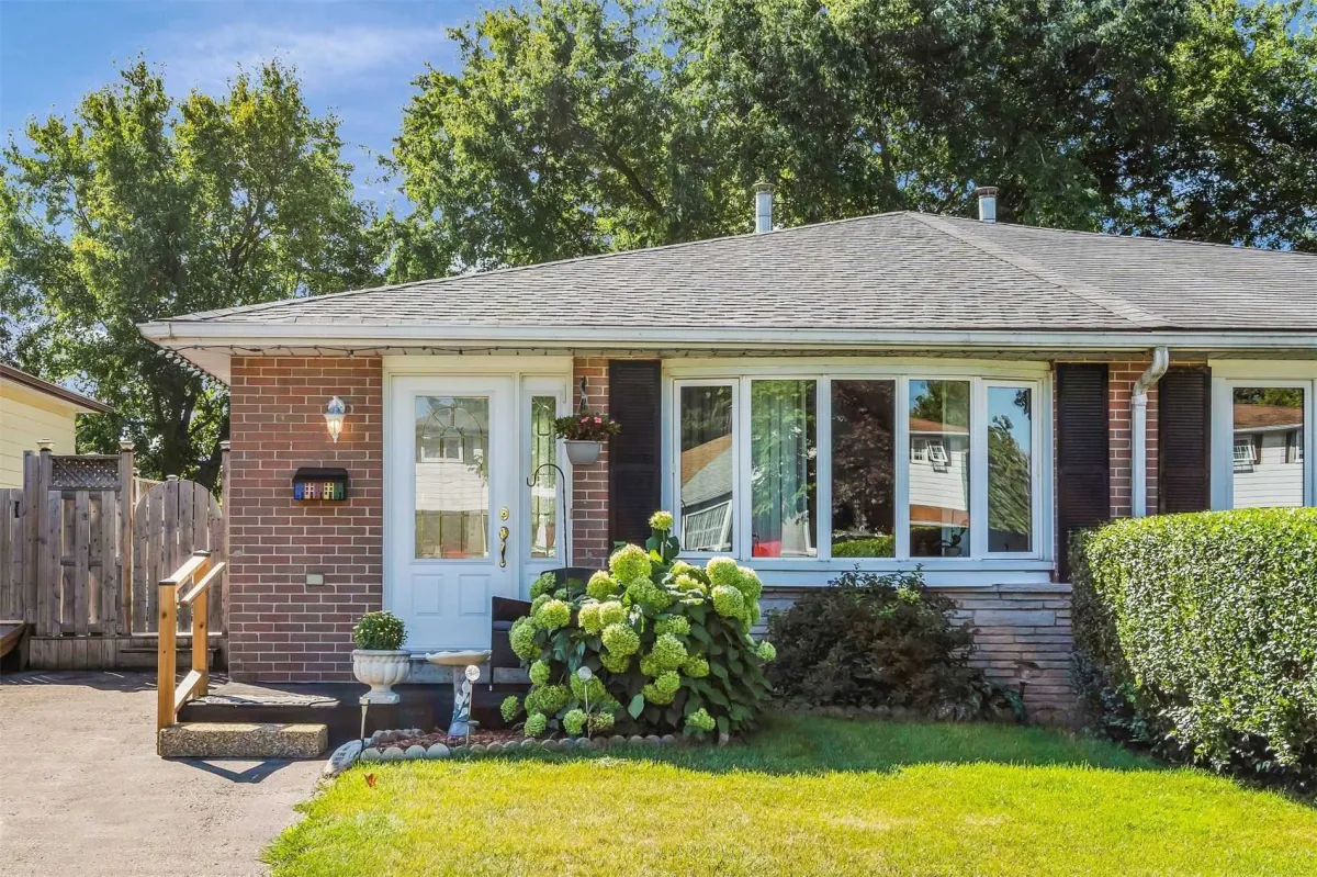 Red brick semi-detached bungalow with mature garden located in the Parkview Acres neighbourhood of Orangeville