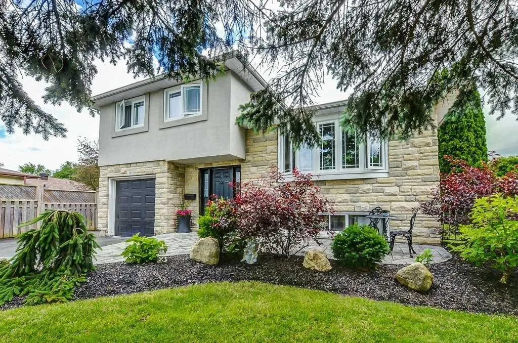Detached split level stone home with garden located in the Parkview Acres in Orangeville