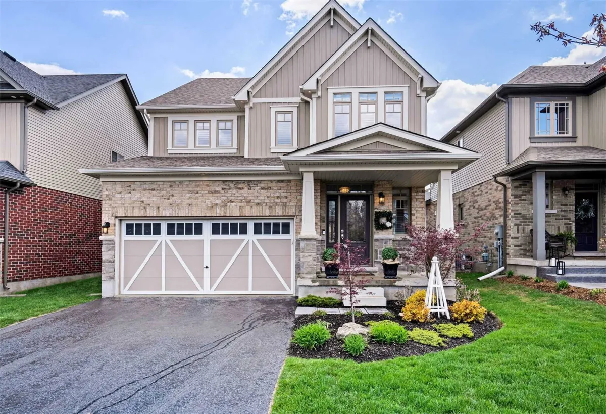 Detached grey brick and siding 2-storey home with attached 2-car garage located in the Veteran's Park neighbourhood in Orangeville
