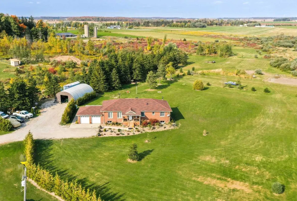 Large red-brick bungalow located on a spacious country lot in Wellington North, Ontario