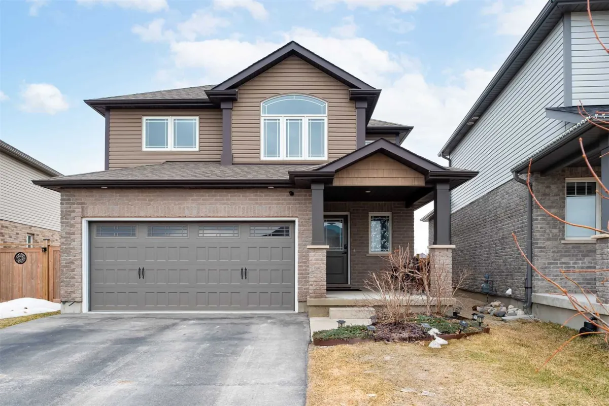 2-storey brick and siding home with covered front porch located in Grand Valley, Ontario